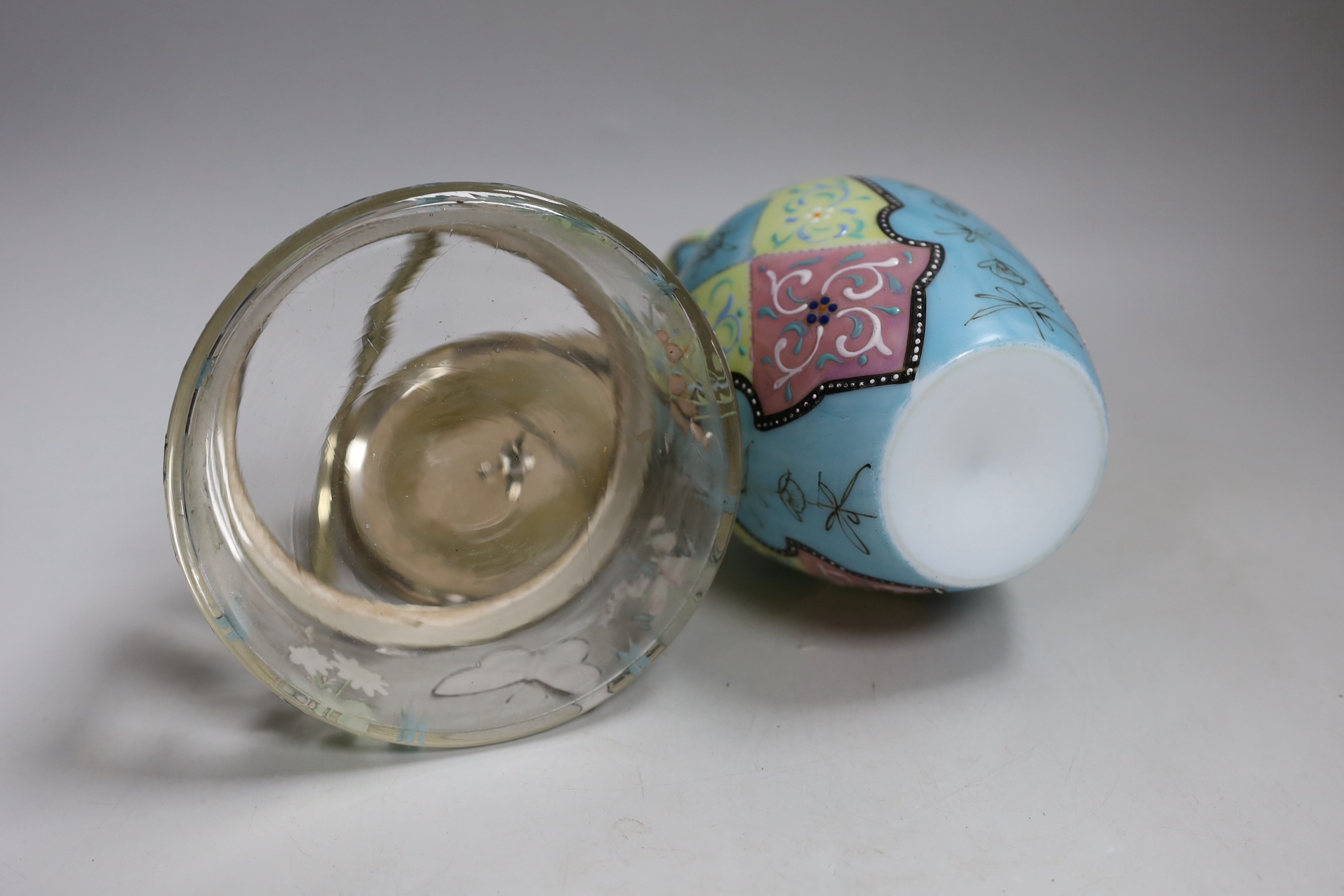 A Bohemian enamelled glass jar with silver plated cover, possibly Moser, together with a French enamelled glass vase. Tallest 20cm